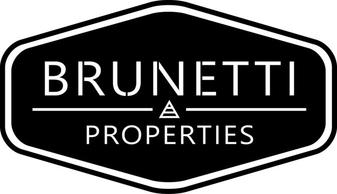 Brunnetti logotipo para agencia inmobiliaria inspirado en estilos clásicos italianos